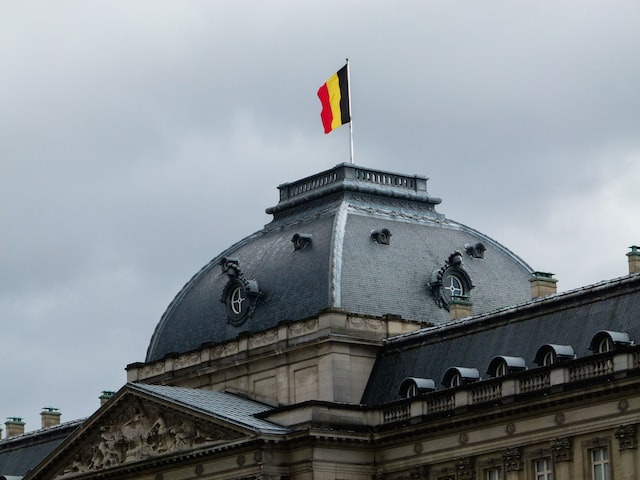 Belgian flag on roof of royal palace in Brussels